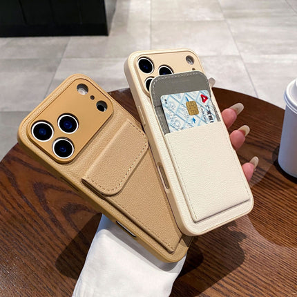 Phone case with card holder held by a hand on a wooden surface