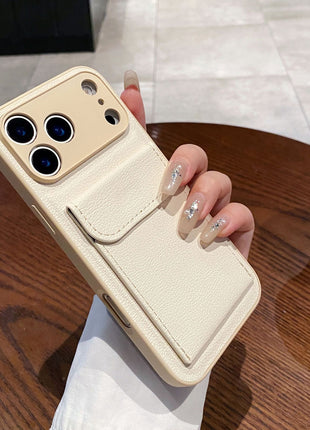 Beige phone case held by a hand on a wooden table with a blurred background